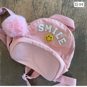 Mini Pink “SMILE” Backpack with Pom Pom Charm